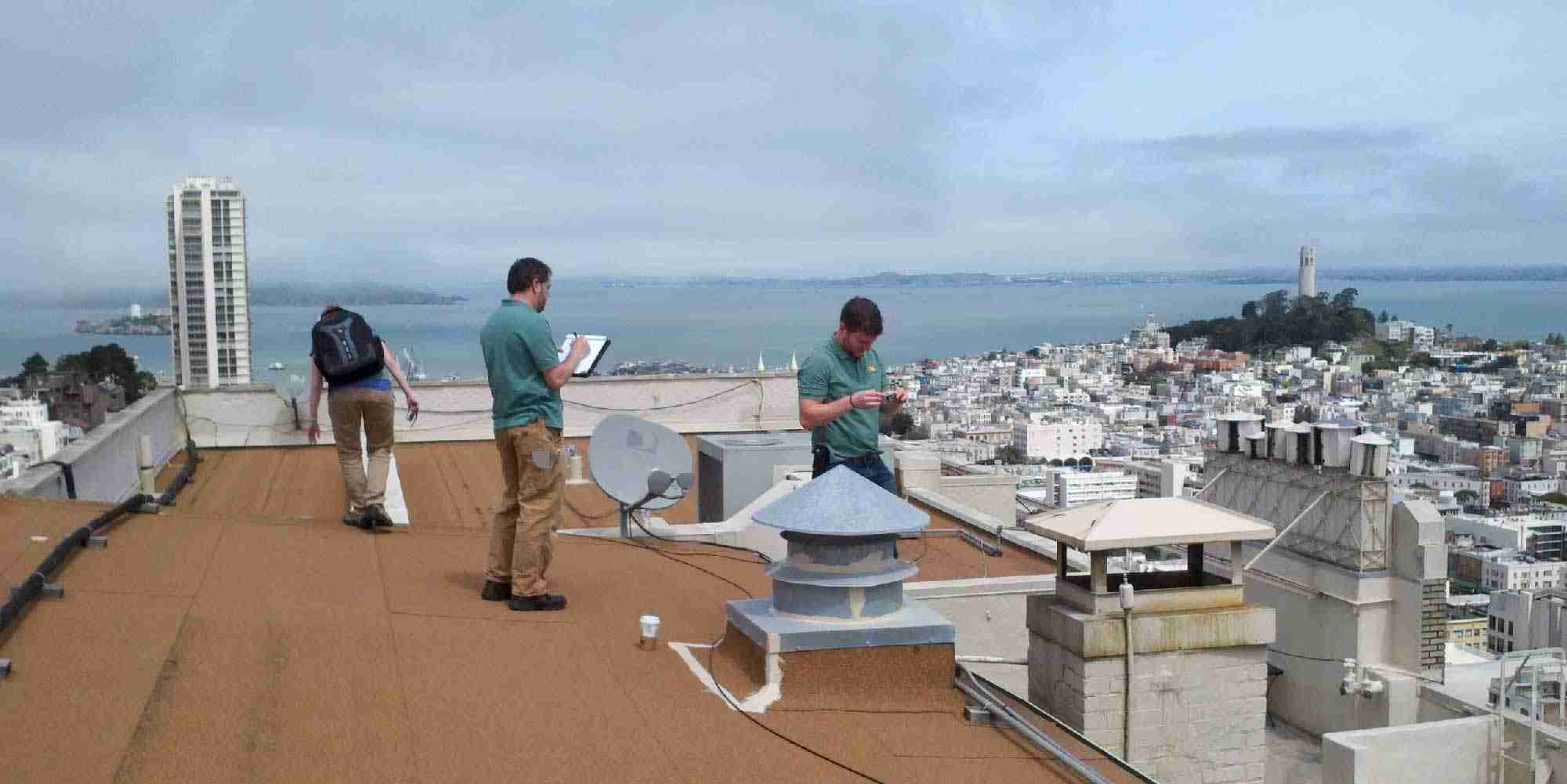 AEA staff conducting a rooftop energy audit in the San Francisco Bay Area