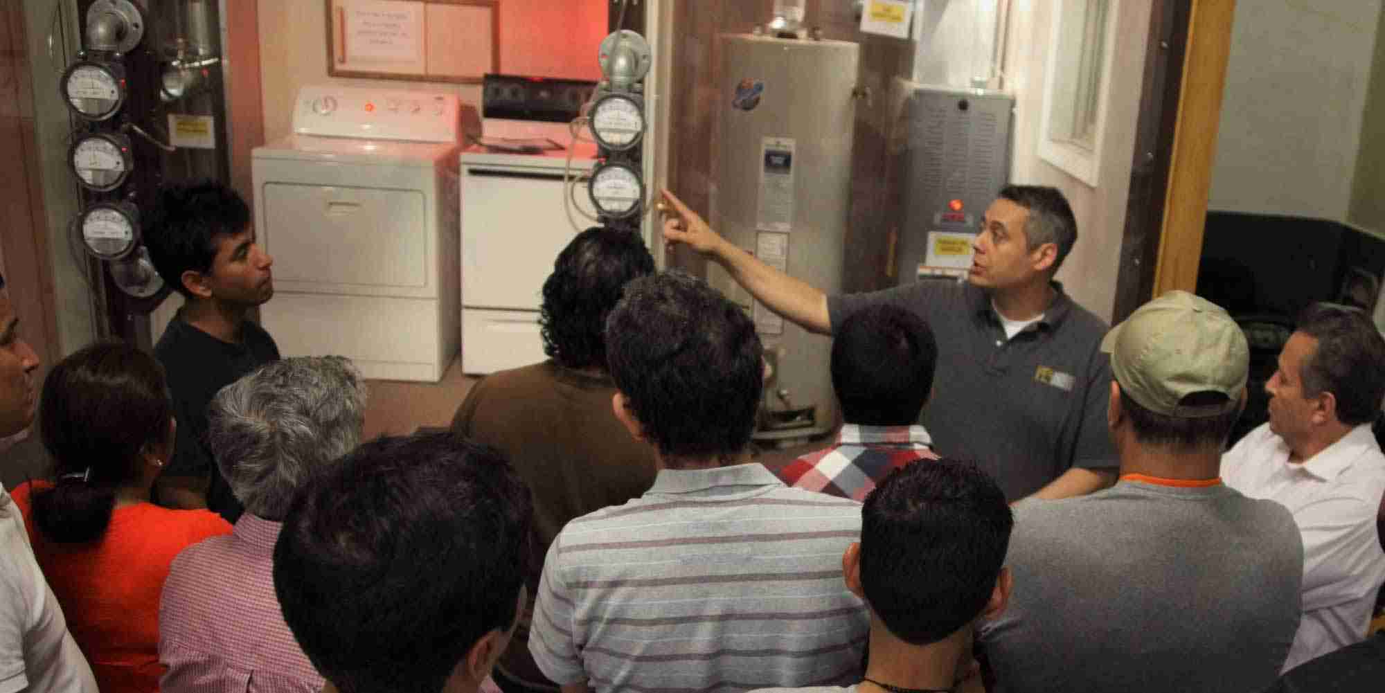 Ramon Casado leading a training on pressure diagnostics in a building science lab