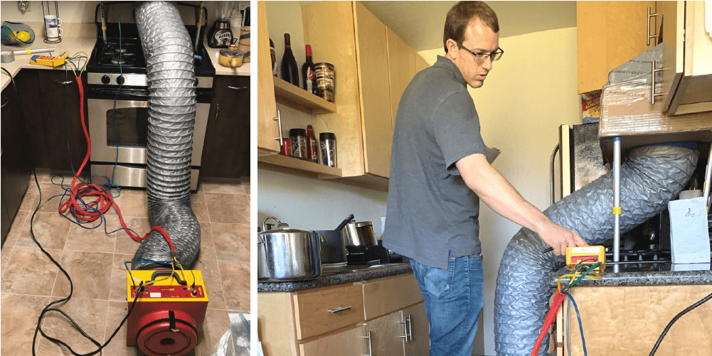 Technician measuring airflow from a kitchen ventilation system using diagnostic equipment