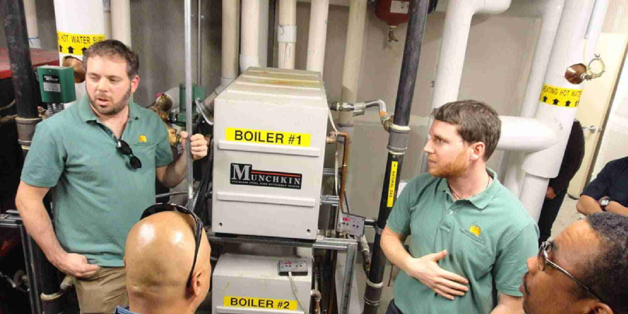 Andy Brooks and Nick Dirr teaching a Multifamily Building Operator course in a boiler room