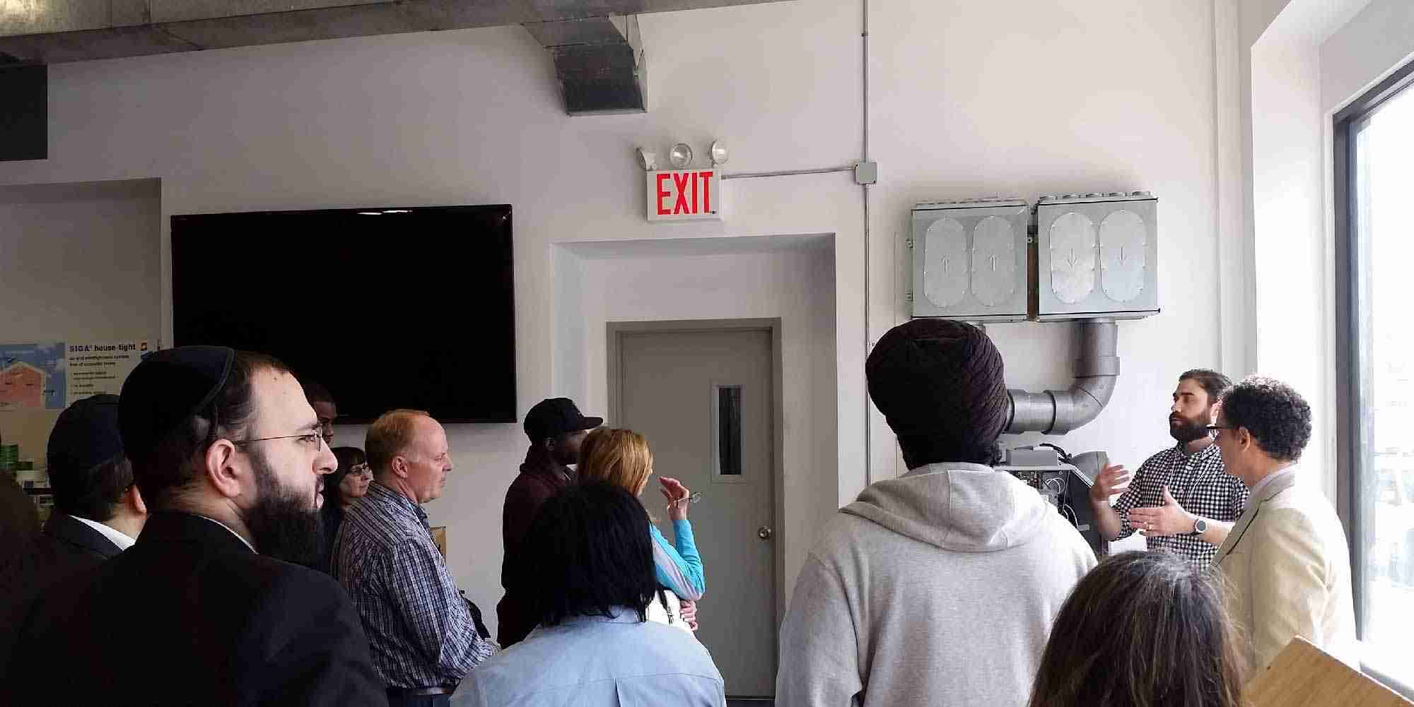 Adam Romano speaking at the NYC WAP Forum at AEA’s Bronx training center, explaining an ERV system
