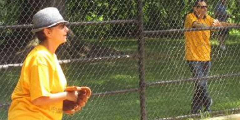 WAP staff member playing catcher during AEA’s Summer Games softball game in Central Park