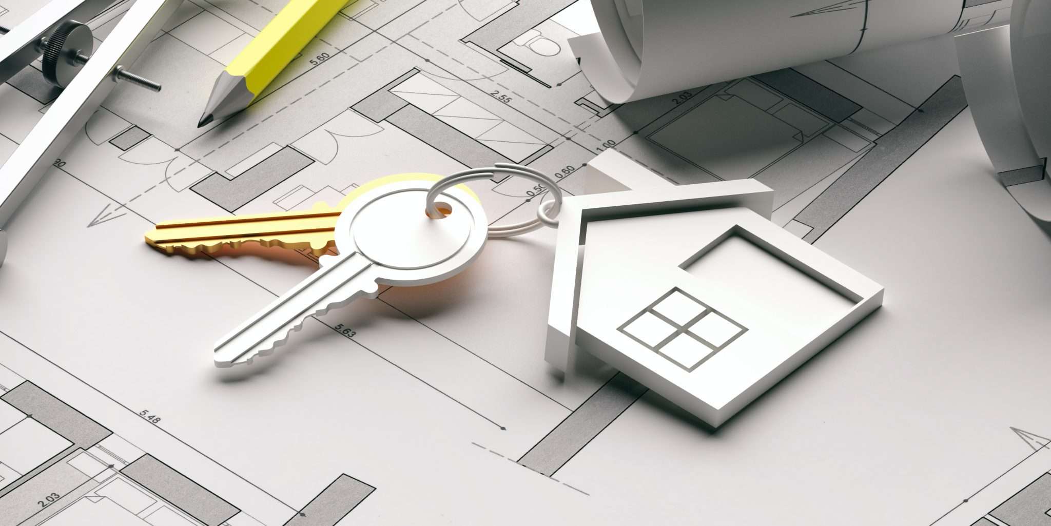 House keys on architectural blueprints representing home design and construction